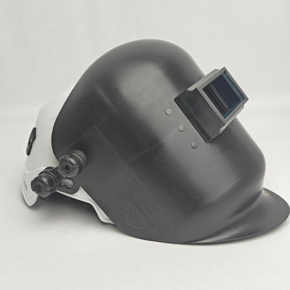 Black welding helmet with a white side panel on a light gray background