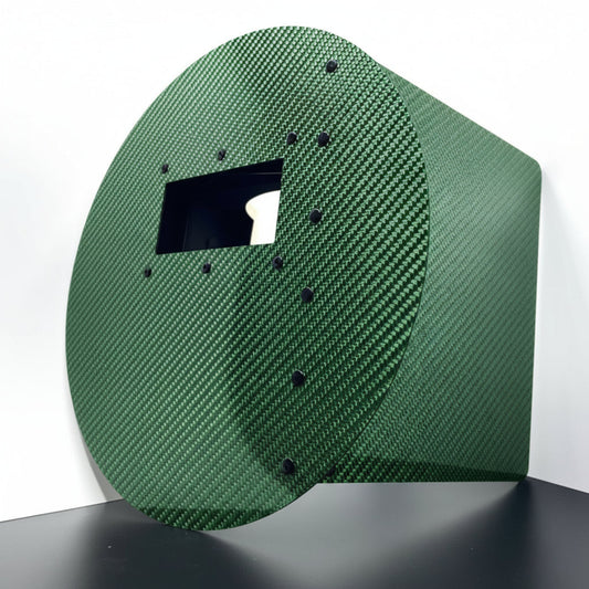 Carbon fiber panel with a textured surface on a white background