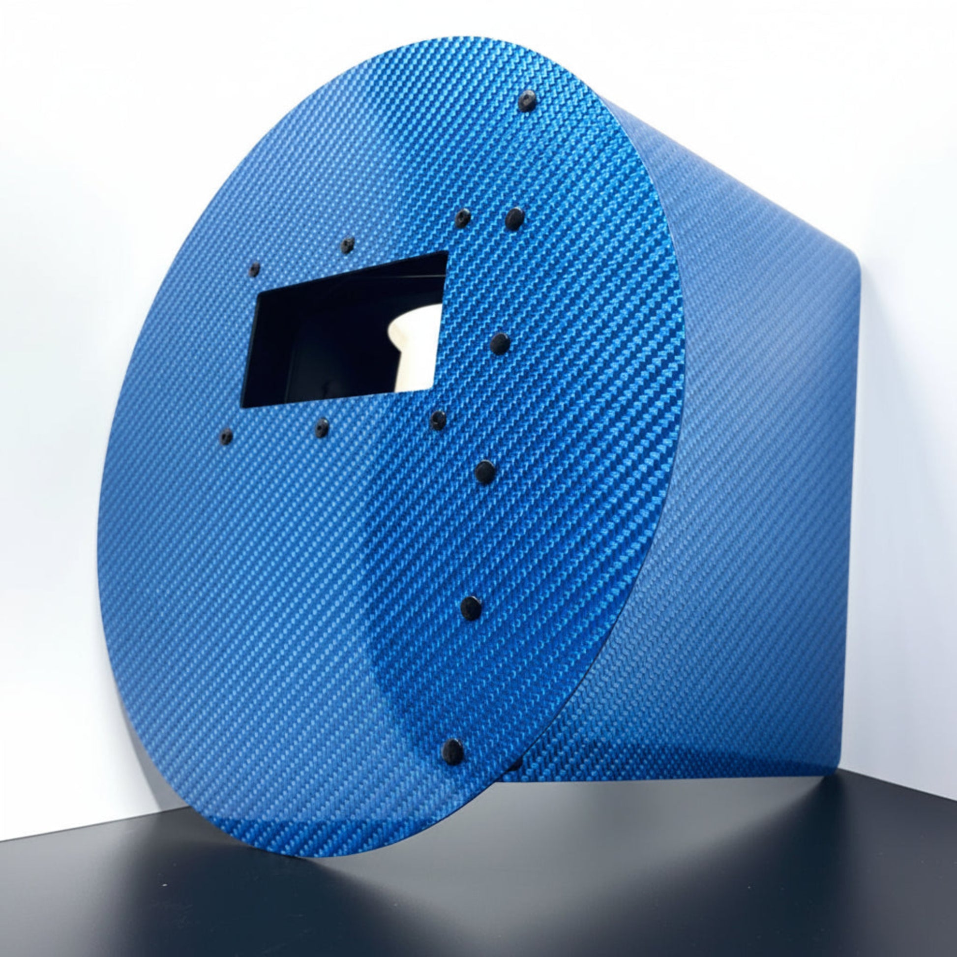 Carbon fiber panel with a textured surface on a white background