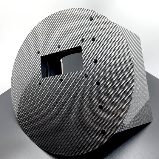 Carbon fiber helmet with a visor on a white background